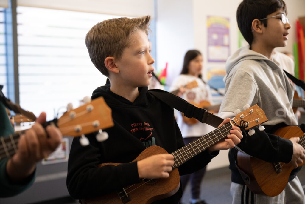 students playing ukulele for music lessons