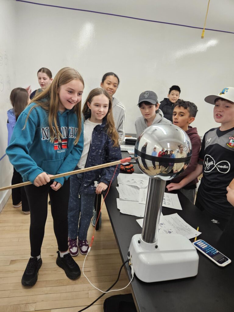 students conducting a hands on activity in grade 6